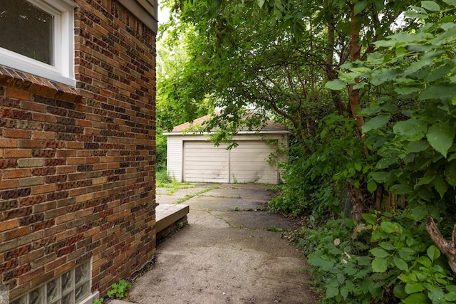 exterior space with an outdoor structure and a garage