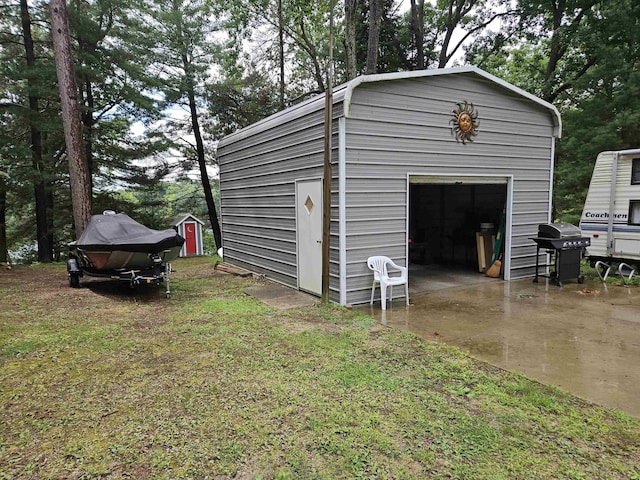 detached garage with a shed