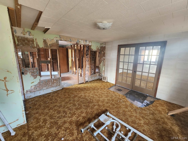 interior space with carpet floors and french doors