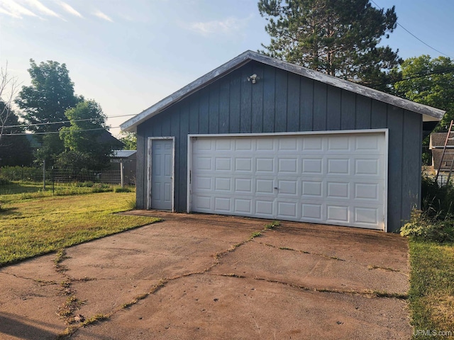 garage with a yard