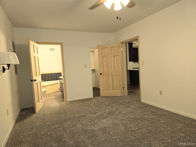 unfurnished bedroom featuring visible vents, baseboards, carpet flooring, and ensuite bathroom