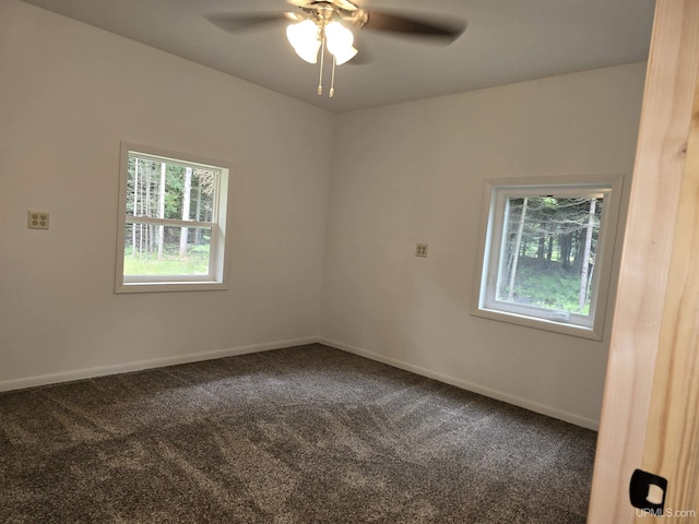 unfurnished room featuring ceiling fan, carpet floors, and baseboards