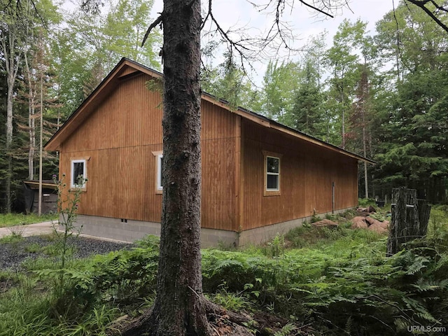 view of property exterior with crawl space