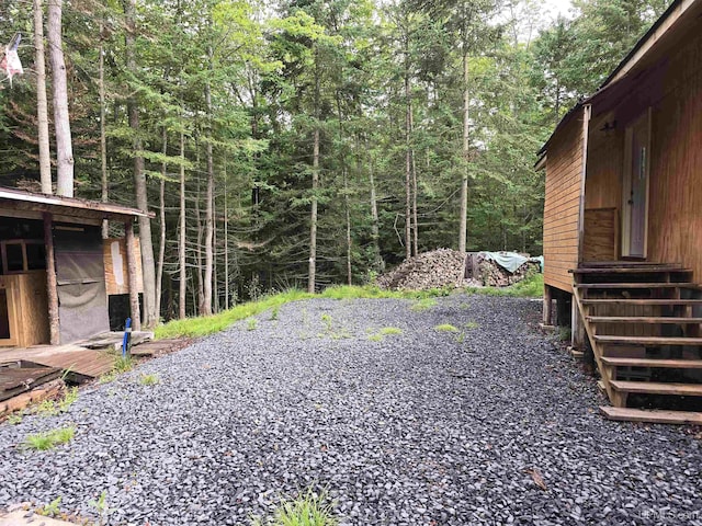 view of yard with a forest view