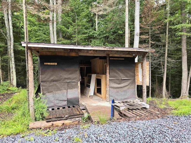 view of outdoor structure with an outdoor structure and a view of trees