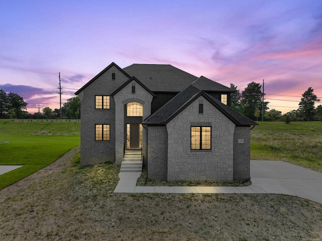 view of front of home with a lawn