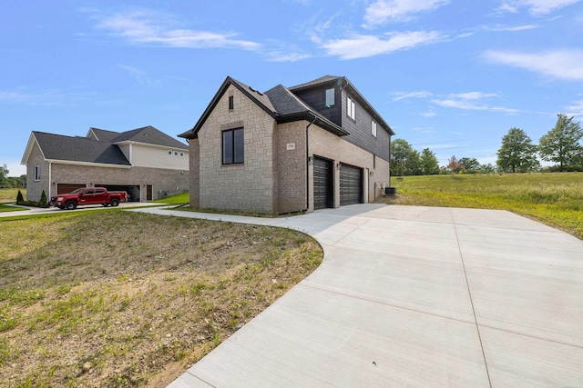 view of front of house featuring a front yard and a garage