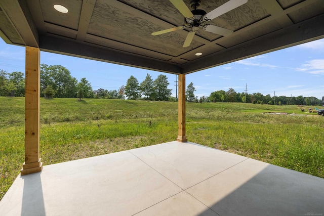 view of patio featuring ceiling fan and a rural view