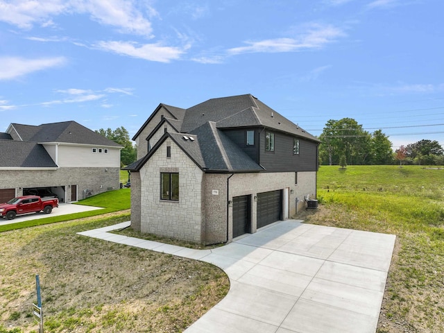 view of front of home with a garage and a front yard