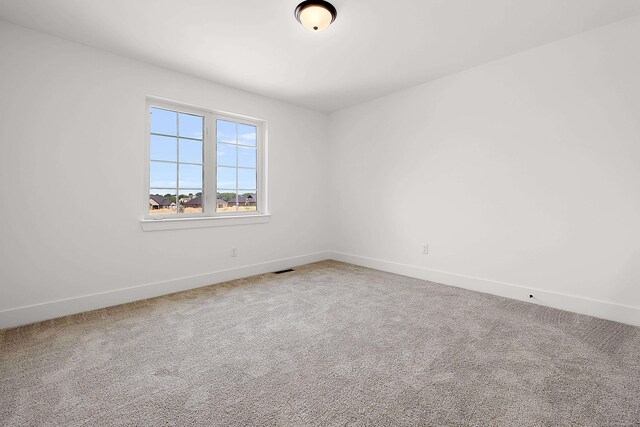 unfurnished room with carpet floors