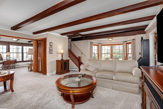 living area featuring light carpet, baseboards, stairway, a baseboard heating unit, and beam ceiling