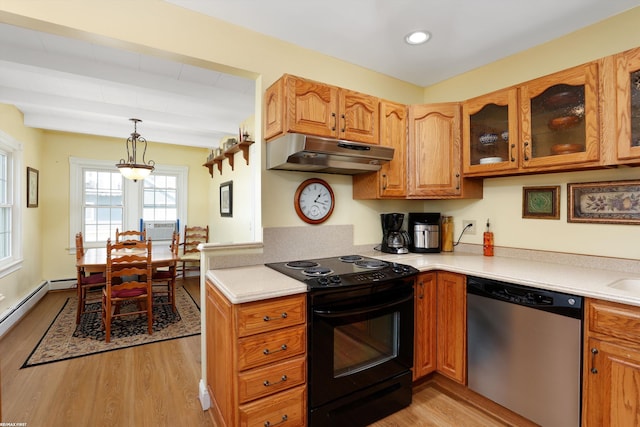 kitchen with black range with electric stovetop, hanging light fixtures, light countertops, under cabinet range hood, and stainless steel dishwasher