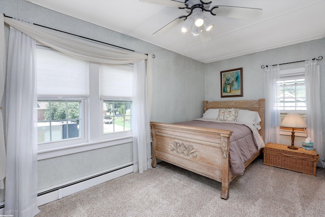 bedroom featuring light carpet, a baseboard radiator, and a ceiling fan