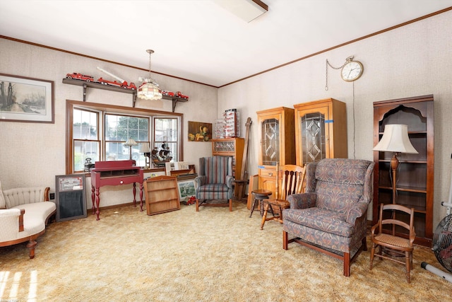 sitting room featuring carpet and crown molding