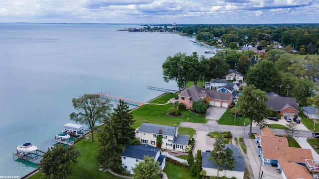 bird's eye view with a water view and a residential view