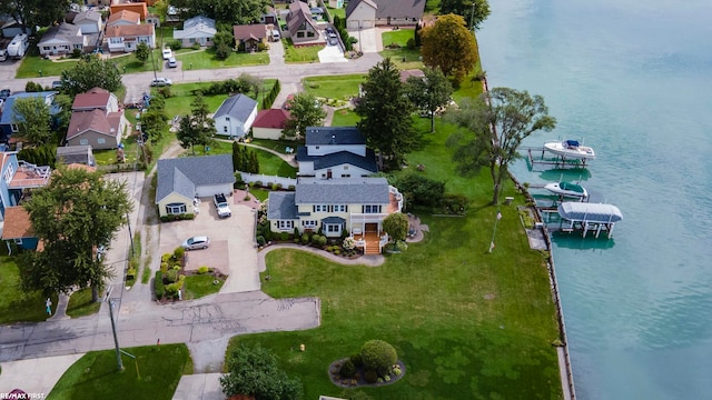 bird's eye view featuring a water view and a residential view