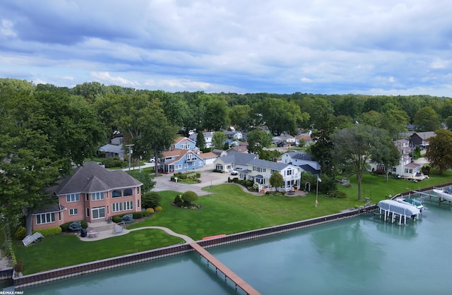 bird's eye view featuring a water view and a residential view