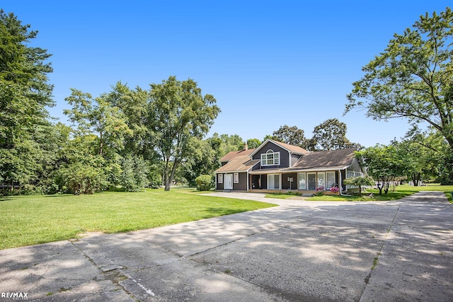 view of front of house with a front yard and a garage