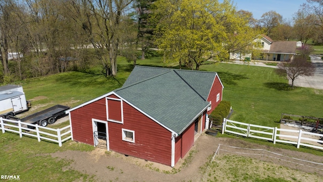 view of outbuilding featuring a yard