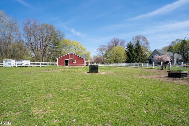 view of yard with a rural view