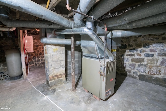 utility room featuring heating unit