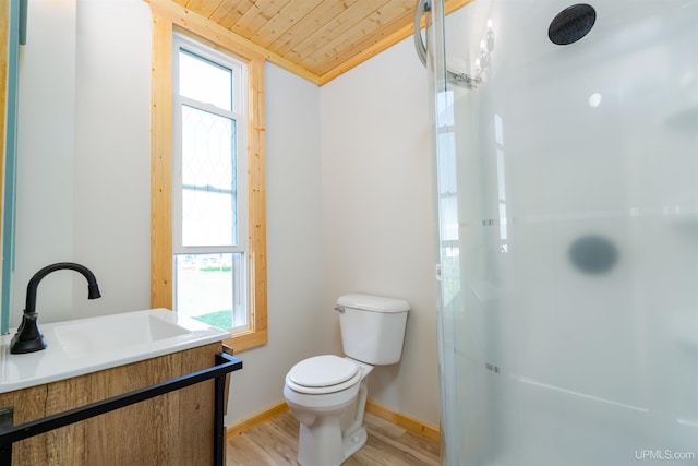 bathroom featuring vanity, hardwood / wood-style floors, walk in shower, wood ceiling, and toilet