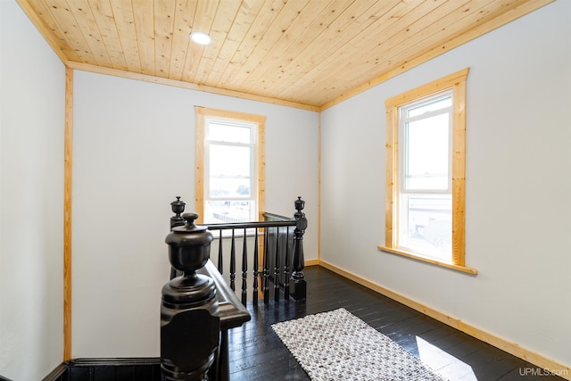 bedroom with ornamental molding, dark wood-type flooring, and wood ceiling