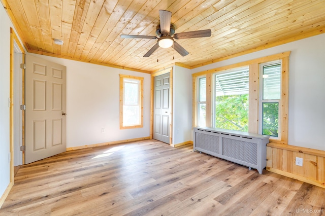 spare room with wood ceiling, ceiling fan, radiator heating unit, and light wood-type flooring