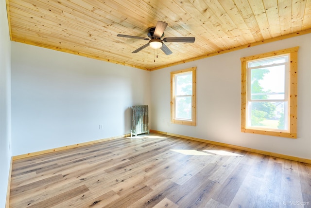 spare room featuring wooden ceiling, a wealth of natural light, and light hardwood / wood-style floors