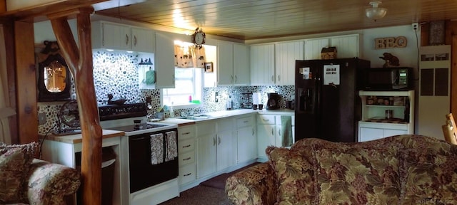 kitchen with sink, decorative backsplash, white cabinets, and black appliances