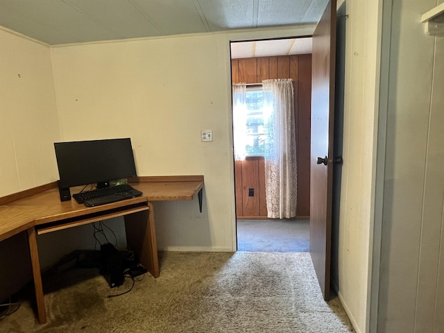 carpeted office space featuring baseboards