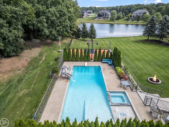 view of pool featuring an outdoor fire pit, a patio, a water view, an in ground hot tub, and a lawn