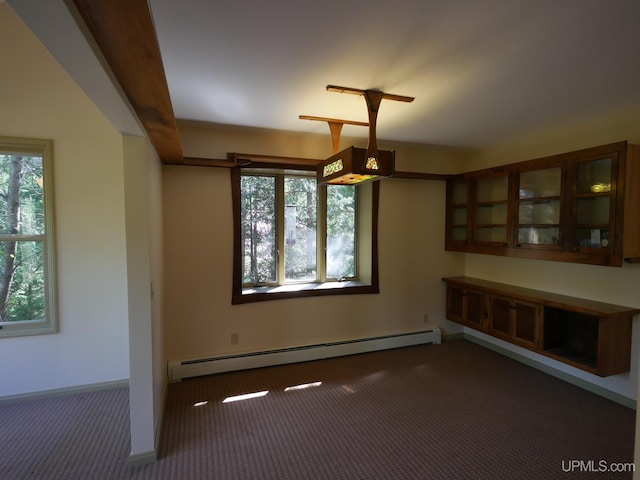 spare room featuring carpet and baseboard heating