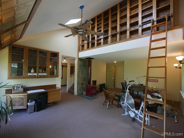 misc room with carpet, high vaulted ceiling, a baseboard radiator, and ceiling fan