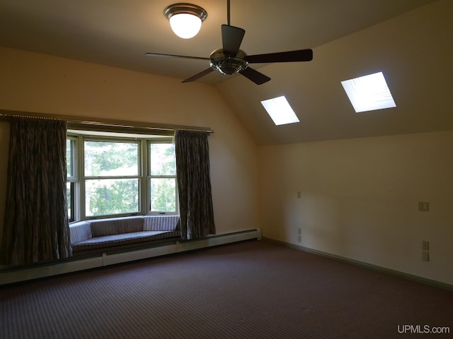 bonus room featuring ceiling fan, a baseboard heating unit, carpet, and lofted ceiling with skylight