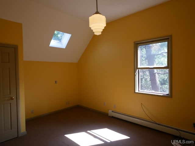 additional living space featuring carpet floors, baseboard heating, a healthy amount of sunlight, and lofted ceiling with skylight