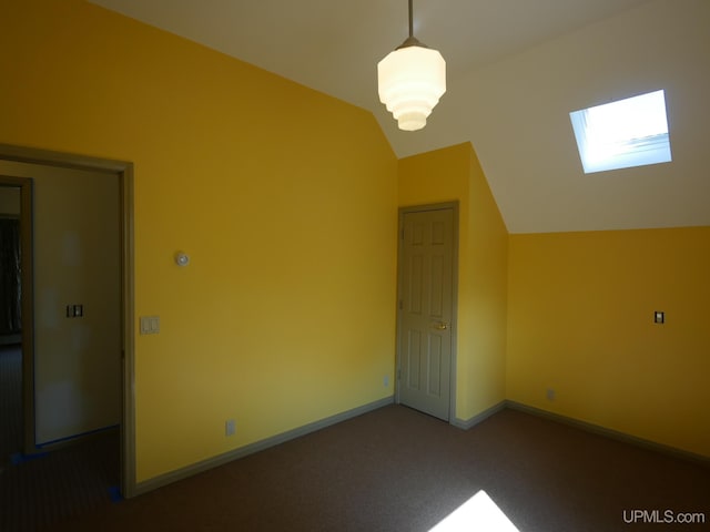 bonus room with carpet and vaulted ceiling with skylight