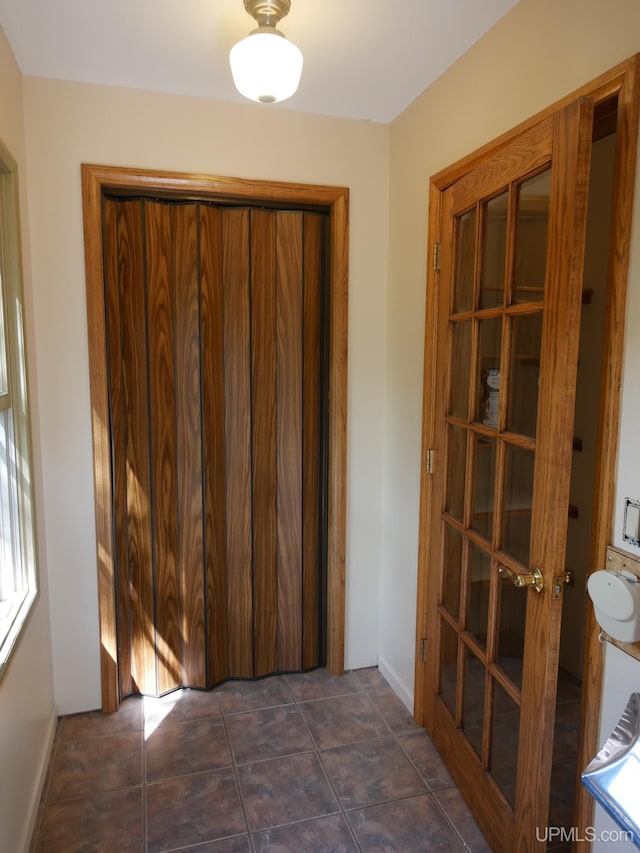 unfurnished bedroom featuring dark tile patterned floors