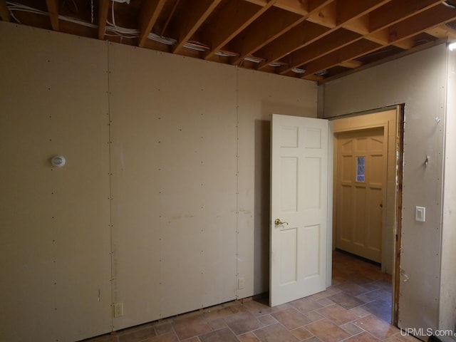 unfurnished room featuring tile patterned flooring