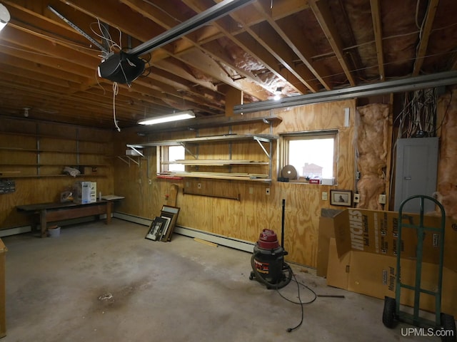 interior space with a baseboard heating unit and electric panel