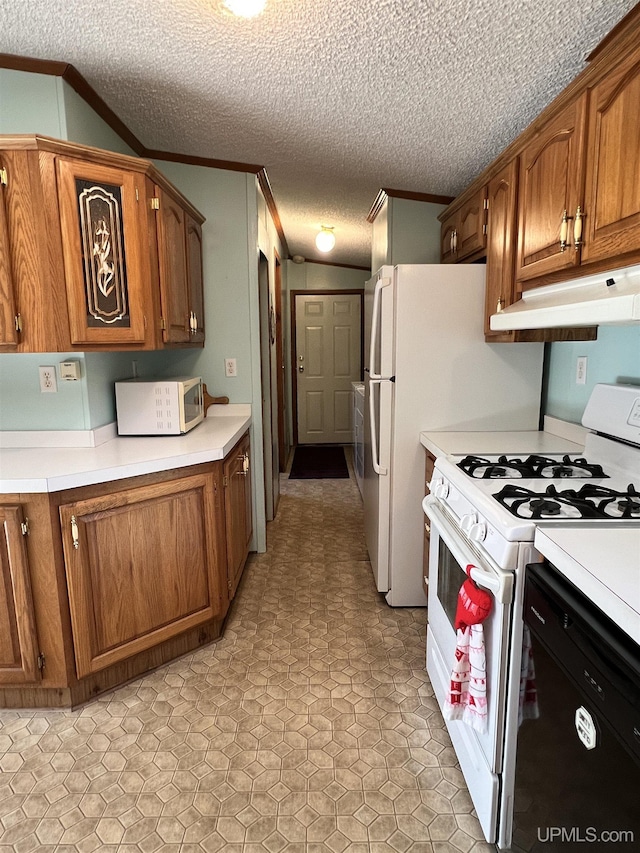 kitchen featuring ornamental molding, white appliances, brown cabinets, and under cabinet range hood