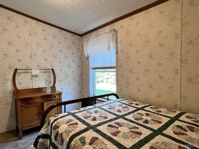 bedroom featuring crown molding, a textured ceiling, and wallpapered walls