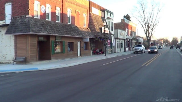 view of road with curbs and sidewalks