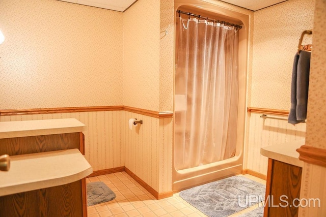 bathroom with tile patterned flooring and vanity