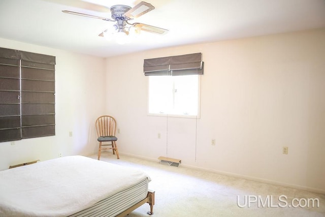 bedroom featuring ceiling fan and carpet flooring