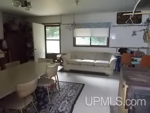 living room featuring concrete flooring