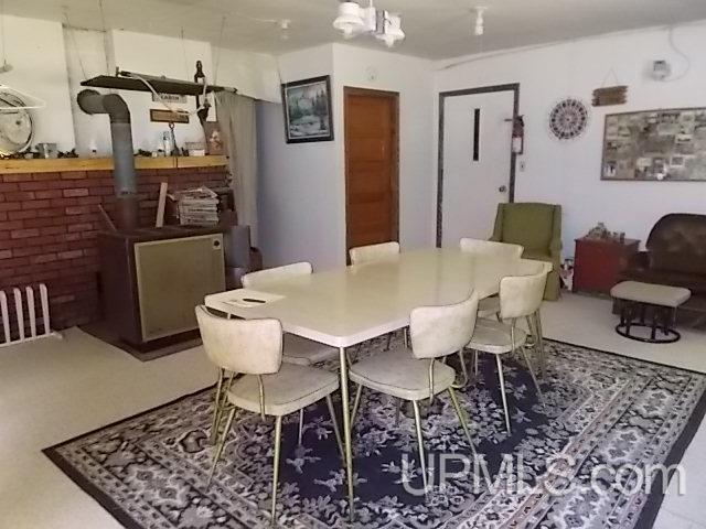 dining area featuring a wood stove