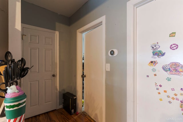 corridor featuring dark wood-type flooring