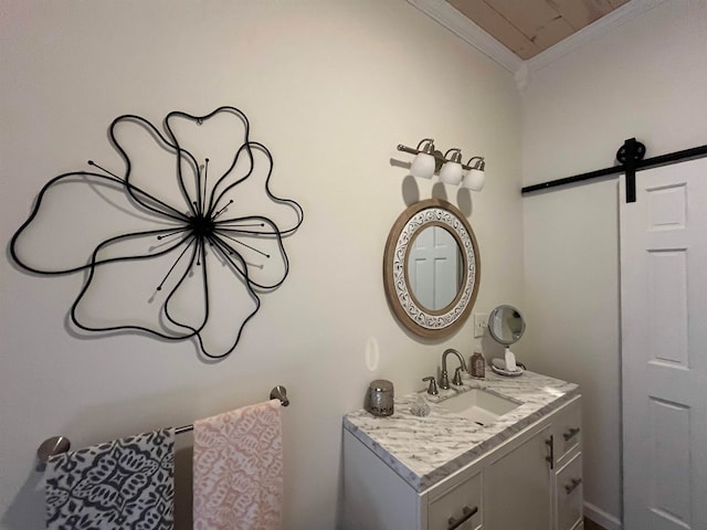 bathroom with ornamental molding and vanity