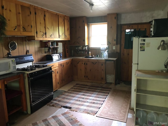 kitchen with sink and white appliances